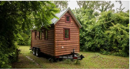 Best friends of 20 years buy plot of land and build tiny town so they can vacation and retire together